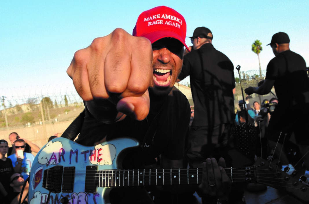 NORCO, CA - AUGUST 10: Musicians Tom Morello, B-Real and Chuck D of Prophets of Rage perform outside of the California Rehabilitation Center on August 10, 2016 in Norco, California. (Photo by Kevin Winter/Getty Images)