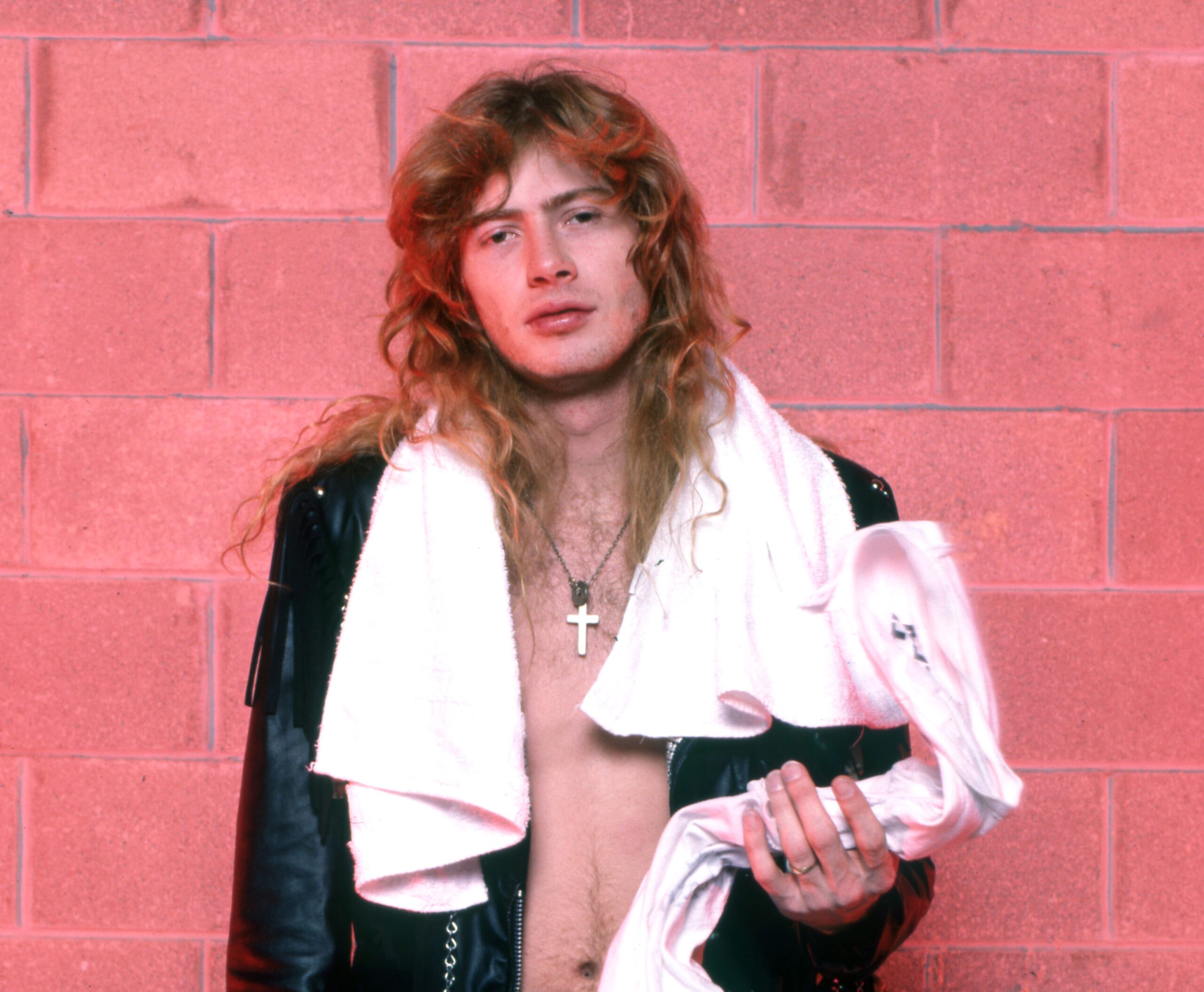 DETROIT - FEBRUARY 13: American co-founder, lead vocalist, guitarist and primary songwriter of the American heavy metal band Megadeth, Dave Mustaine, poses backstage at the Joe Louis Arena during the band's "Waking Up Dead Tour" on February 13, 1987, in Detroit, Michigan. (Photo by Ross Marino/Getty Images)