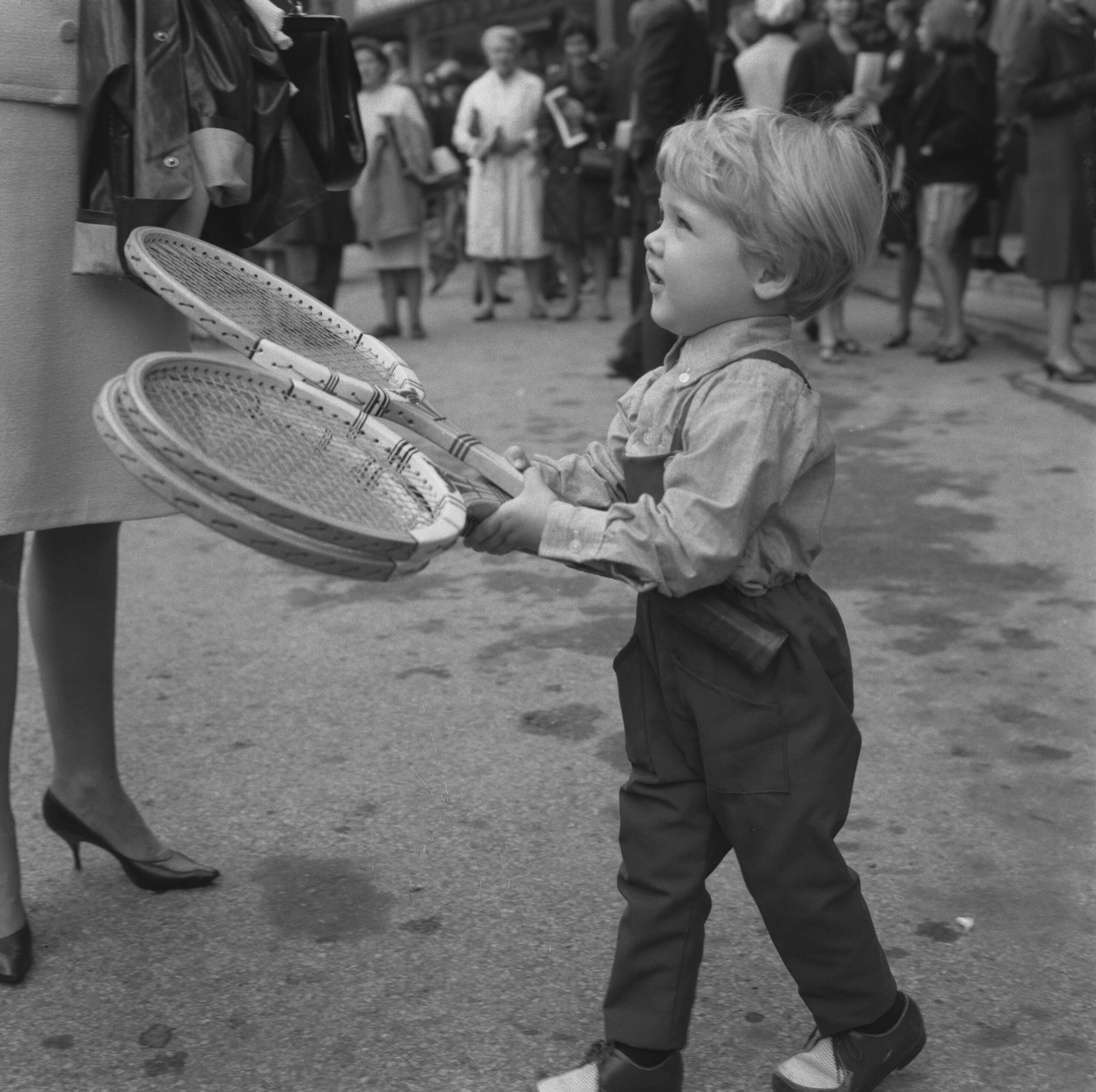 Lars Ulrich, the son of Danish tennis player Torben Ulrich, accompanies his father to Wimbledon, London, UK, June 1966. Lars later became the drummer and co-founder of heavy metal band Metallica. (Photo by Evening Standard/Hulton Archive/Getty Images)