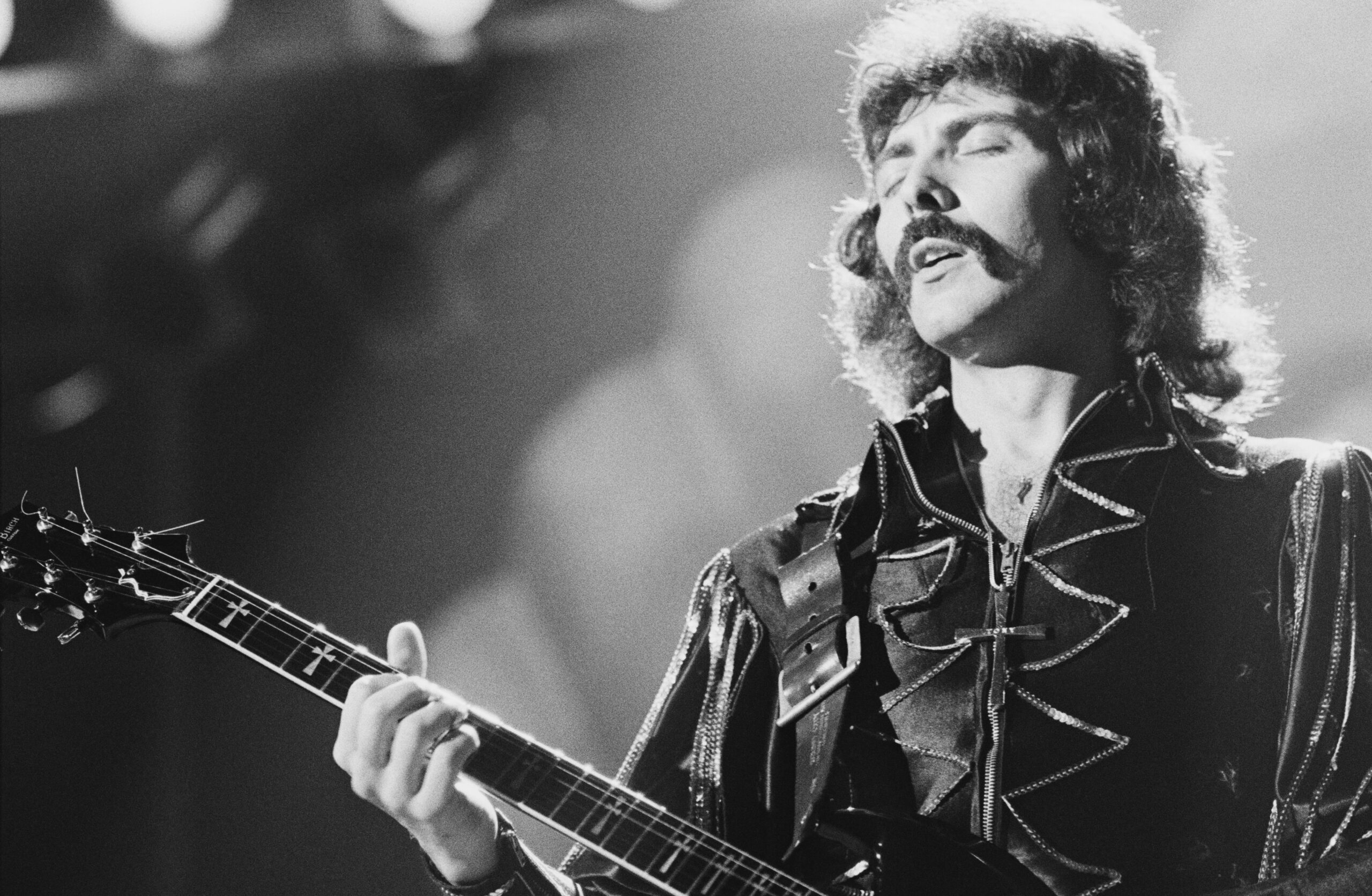 Tony Iommi of Black Sabbath performs on stage at Hammersmith Odeon, London, January 1976. (Photo by Erica Echenberg/Redferns)