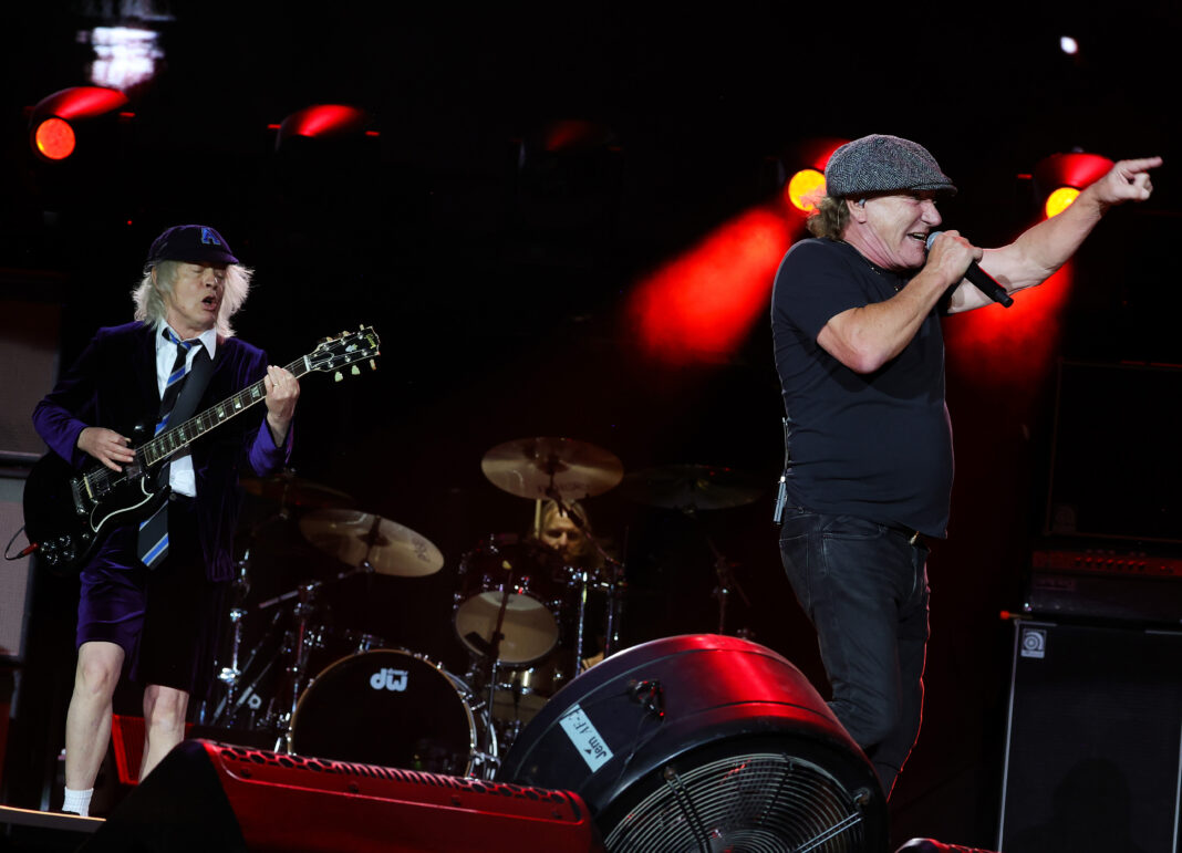 INDIO, CALIFORNIA - OCTOBER 07: (EDITORIAL USE ONLY) (L-R) Angus Young and Brian Johnson of AC/DC perform onstage during the Power Trip music festival at Empire Polo Club on October 07, 2023 in Indio, California. (Photo by Kevin Mazur/Getty Images for Power Trip)