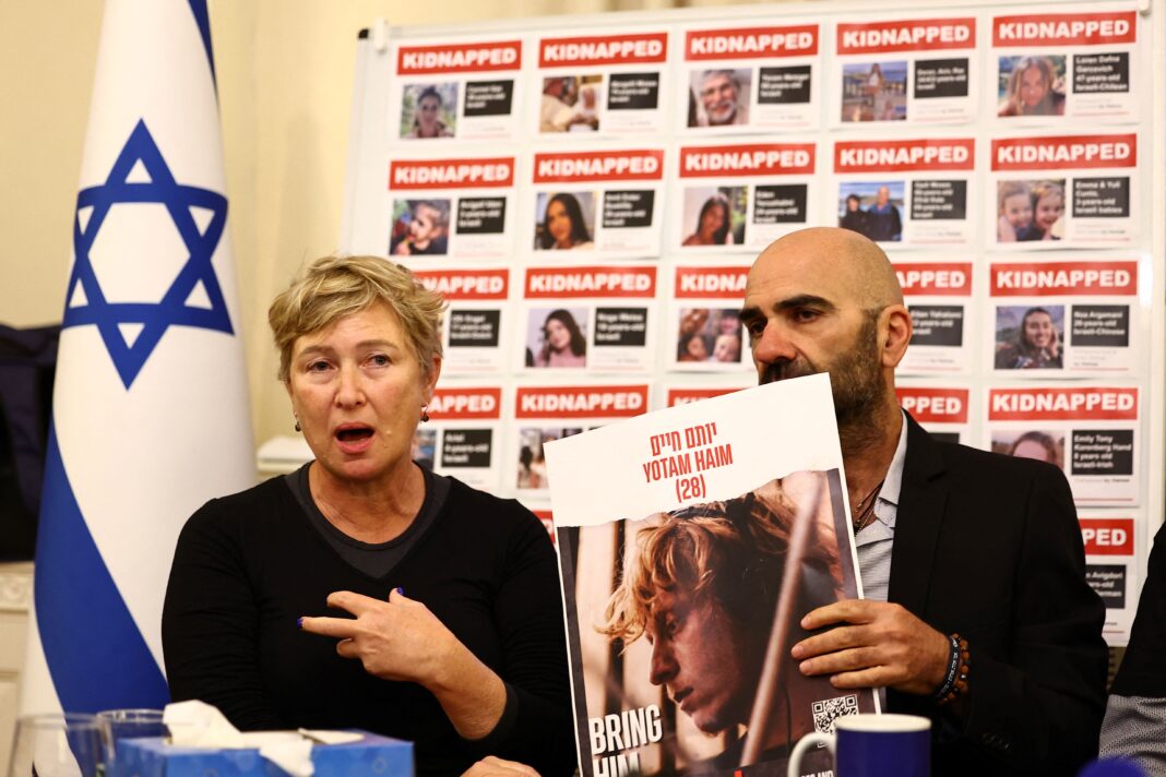 Iris Haim (L), mother of Yotam Haim, speaks next to Doron Libstein, who lost several members of his family in the October 7 Hamas attacks, attend a press conference by families of hostages held by Palestinian militant group Hamas in Gaza, at the embassy of Israel in London on November 20, 2023. Fighting raged in Gaza, more than six weeks after a shock Hamas attack sparked an air and ground offensive by Israel, which has vowed to destroy the Palestinian militant group. In Gaza, around 13,000 people, more than 5,500 of them children, have been killed in the conflict, officials in the Hamas-run territory have said. About 1,200 people, mostly civilians, were killed in Israel during the October 7 attack and around 240 taken hostage, according to Israeli officials. (Photo by HENRY NICHOLLS / AFP) (Photo by HENRY NICHOLLS/AFP via Getty Images)