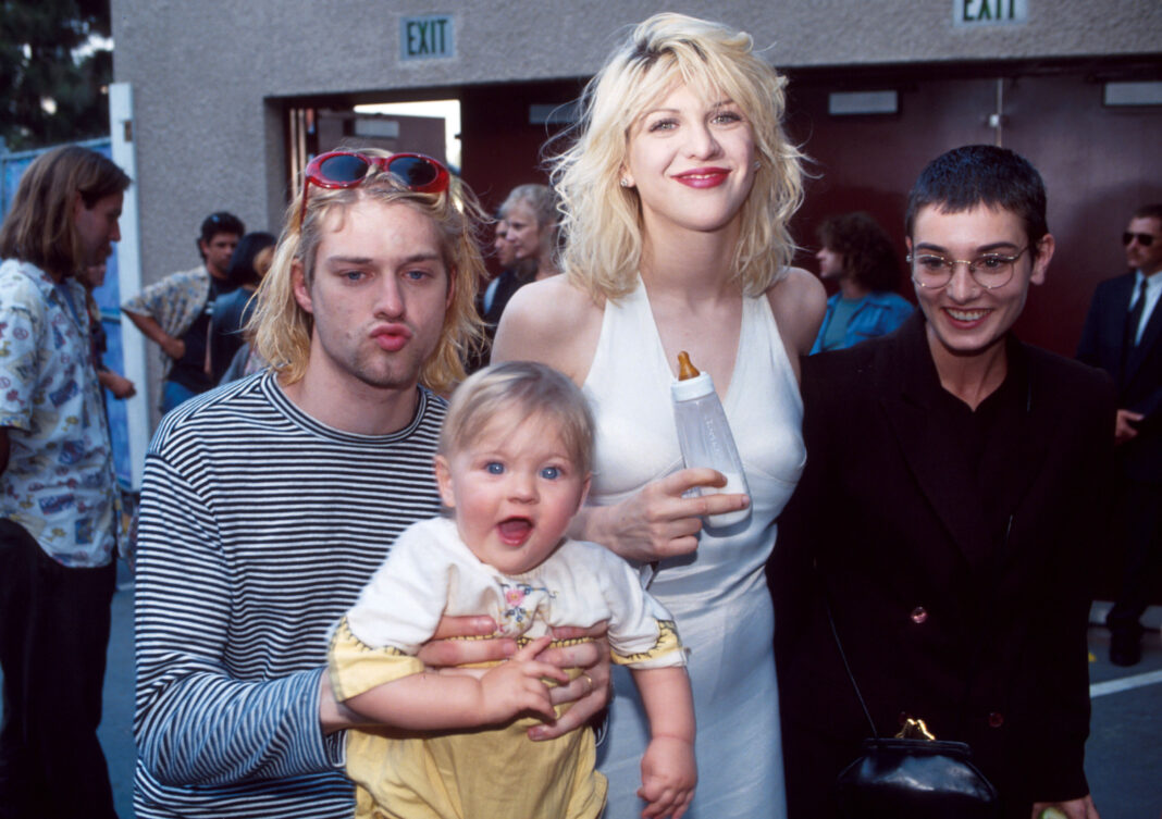 Kurt Cobain of Nirvana (right) with wife Courtney Love and daughter Frances Bean Cobain, and Sinead O'Connor (Photo by Kevin Mazur/WireImage)